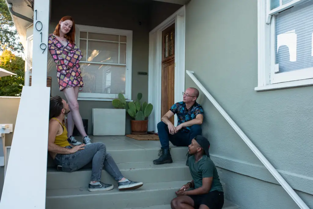 group of transgender friends hanging out on the porch during pride
