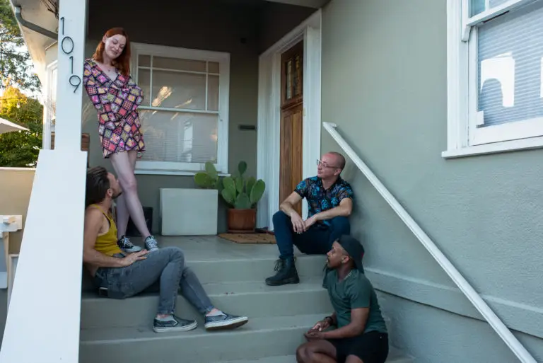 group of transgender friends hanging out on the porch during pride