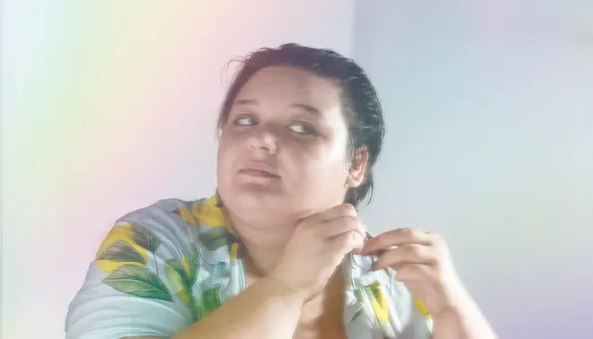 Close-up of a person adjusting their earring