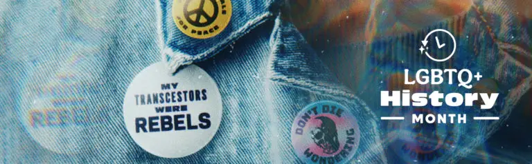 Denim jacket with pins reading “My Transcestors Were Rebels,” “Don’t Die Wondering,” and a peace sign, alongside text that says “LGBTQ+ History Month."